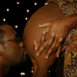 Black Man kissing his Lady's Pregnant Belly