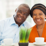 cute senior african couple portrait at home